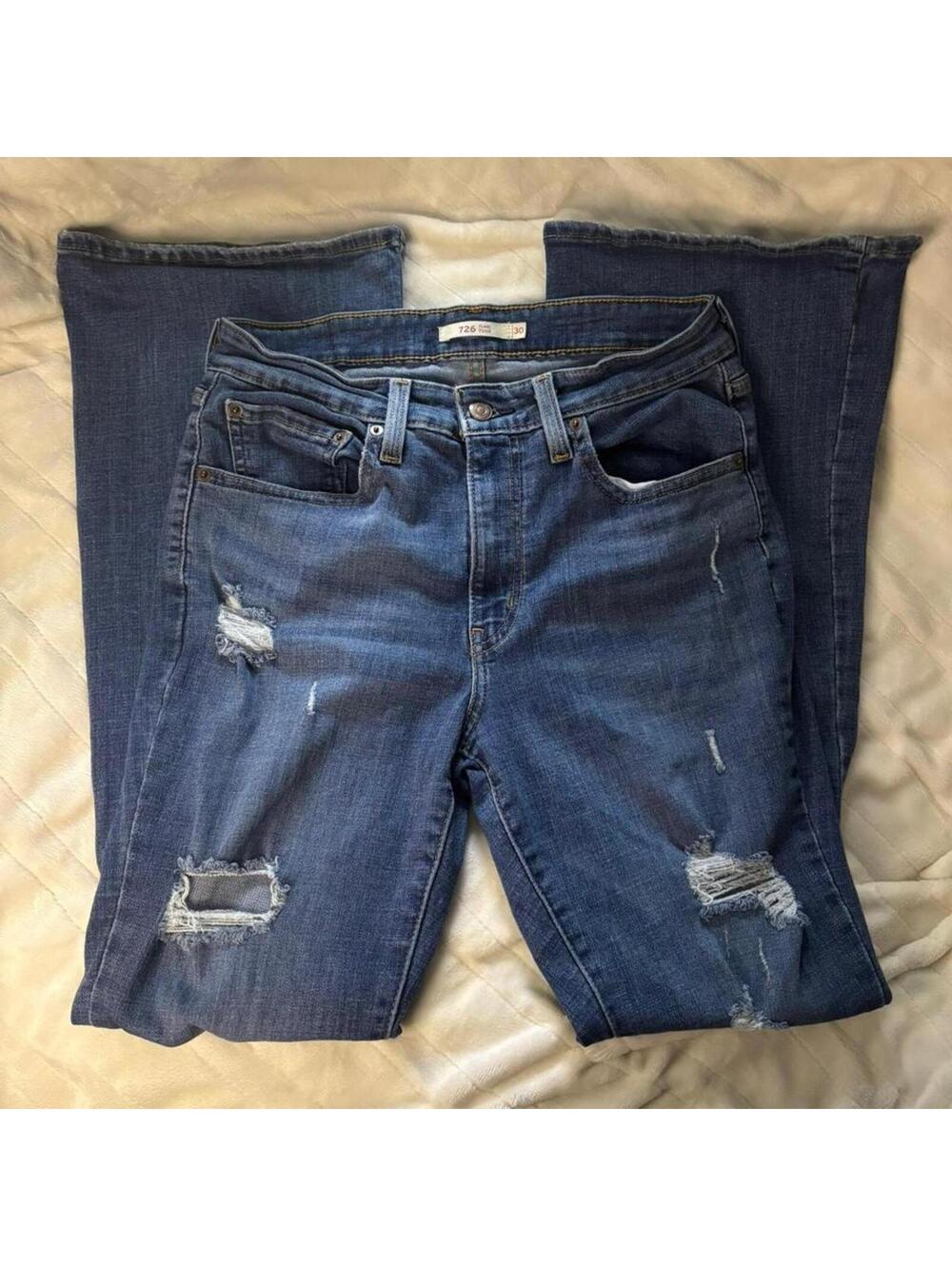 Levi flare blue jeans with distressed details